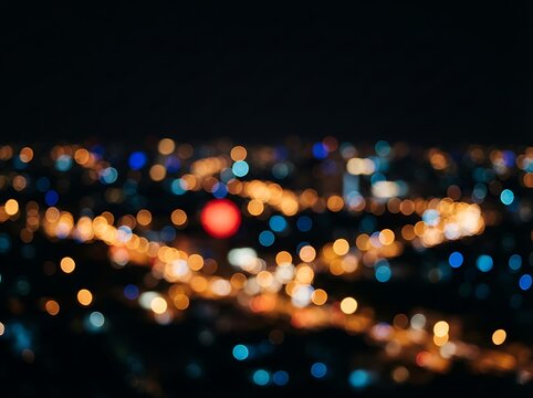 City lights glowing in dark night bokeh background with blurred illumination and colorful street lights