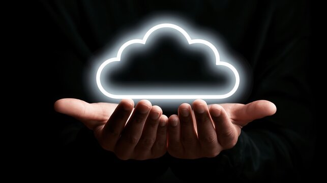 Hands gently holding a bright, glowing cloud shape, representing digital data and technological cloud computing concept