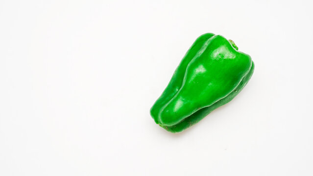 Whole green bell pepper produce