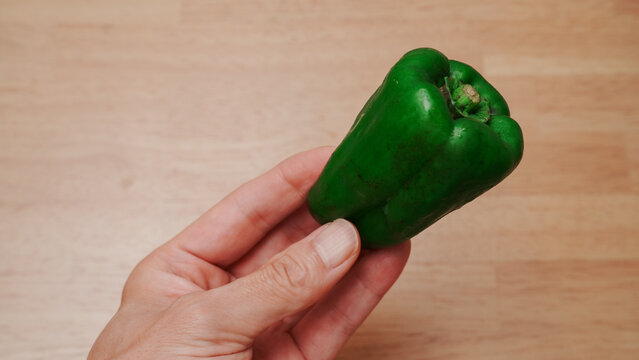 Whole green bell pepper produce