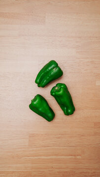Whole green bell pepper produce