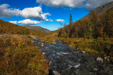 Mountain river in Khibiny mountains, Kola Peninsula, Russian Arctic region © sablinstanislav