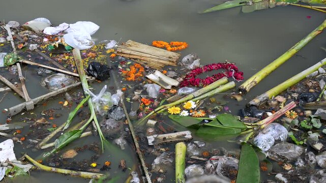 Polluted river bank with religious waste thrown