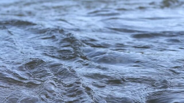 Clear stream running boulders Abundant river flowing in slow motion. Wild mountain water splashing in summer day. underwater bubbles. 4K. Wave Ripple wavy. blue ocean sea surface. nature landscape