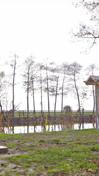 Nature park with lake and wooden seats for tourists