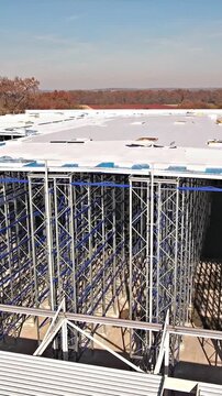 Flying closer to warehouse frames while being built