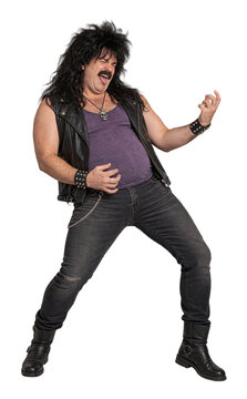 Mustached man miming a guitar with long curly black hair and a leather vest over a purple top isolated on transparent background.