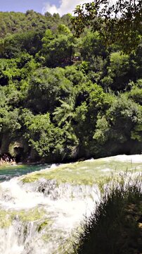 Krka waterfall from inside the forest view