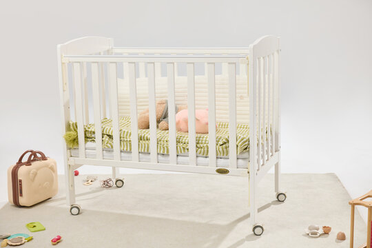 White Baby Crib in Bright Minimal Nursery