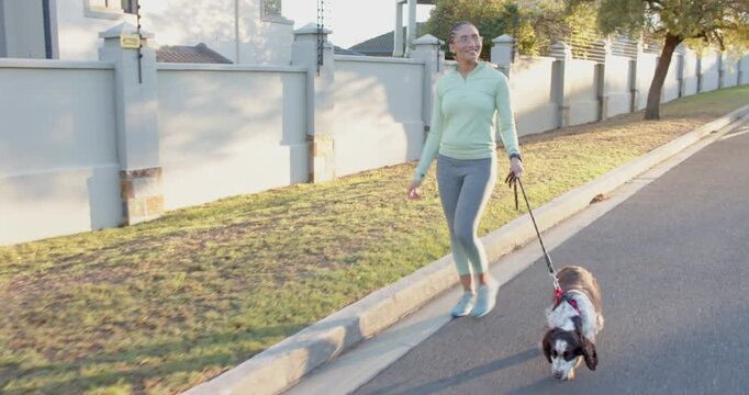 Lifestyle videos outdoor of people doing activities, walking dog on leash, woman enjoying outdoor ex
