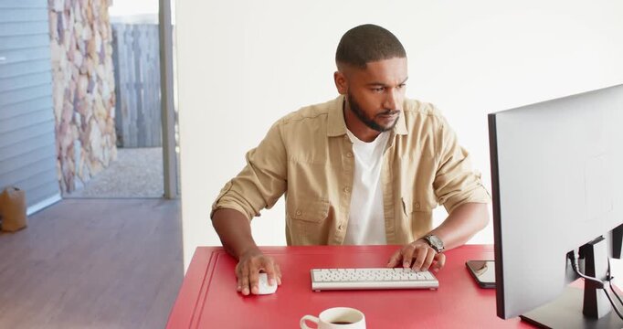 Lifestyle videos indoor of people doing activities at home, working from home, man using desktop com