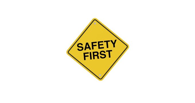 4k Resolution Video: Safety, Prevention, Protection And Workplace Awareness Concept. Yellow Safety First Warning Sign Animating On White Background With Alpha Matte