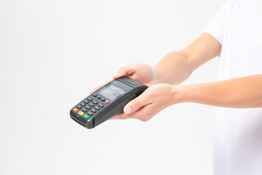 Hands Holding Payment Terminal for Cashless Retail Transaction