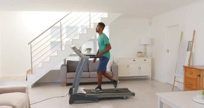 Lifestyle videos indoor of people doing activities at home, exercising at home, man walking on tread