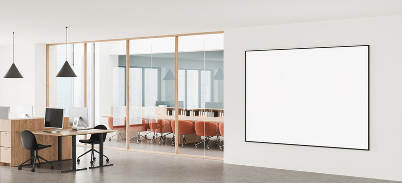 Modern office interior with glass meeting room, desks, pendant lights, and large empty wall poster mockup template for branding display. 3D Rendering