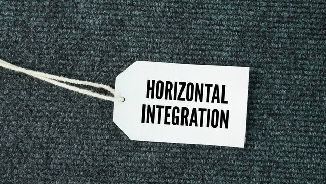 Price tag with word Horizontal integration is a business strategy where a company acquires or merges with another company operating at the same stage of the value chain in the same industry