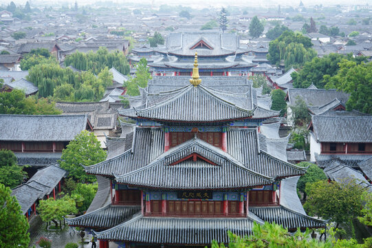 Aerial view of traditional Chinese pagoda and historic old town rooftops