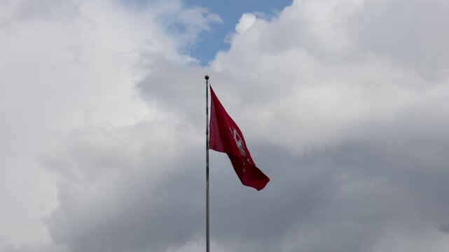 Historical state flag of Lithuania with Vytis knight emblem in Kaunas city