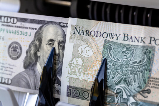 Dollar vs. Polish Zloty. Currency exchange rates, Zlotys to dollar. Financial and business concept. Poland money. Close up