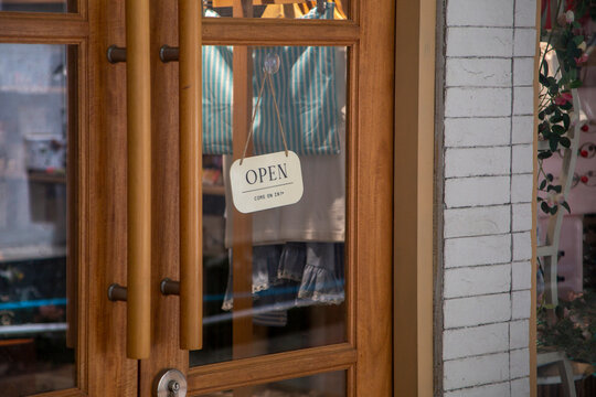 open sign hanging outside a restaurant, store, office or other