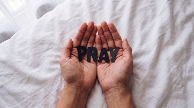Open Hands Holding the Word Pray on Bed