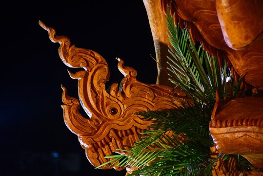 ​Detailed wax statue depicting Thai traditional art during Buddhist Lent Candle Parade festival