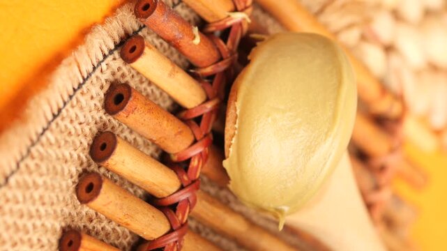 Close up of green paste being scooped by a wooden spoon food preparation motion.