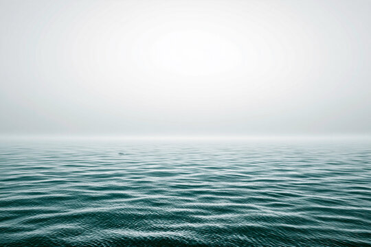 An expansive view of a greenish blue sea with a textured surface of gentle ripples.