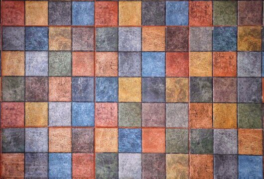 Textured wall with a variety of colors suitable for background