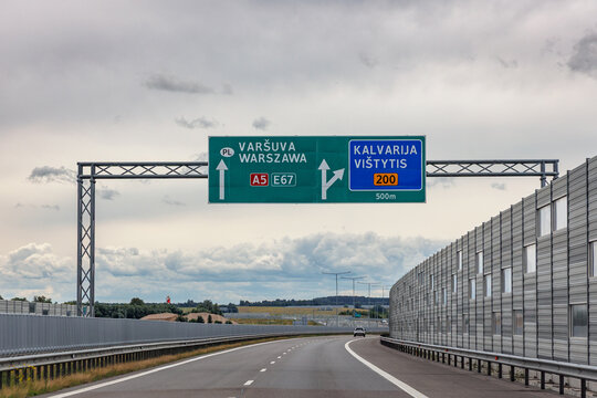 Highway direction road sign to Warsaw and Kalvarija on A5 E67 in Lithuania