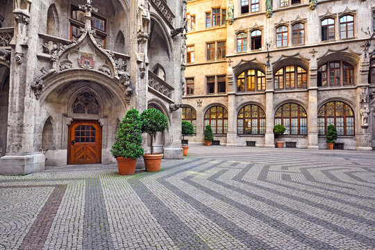 Interior Courtyard of New Town Hall with Ornate Gothic Architecture and Cobblestone Pavement in Munich Germany