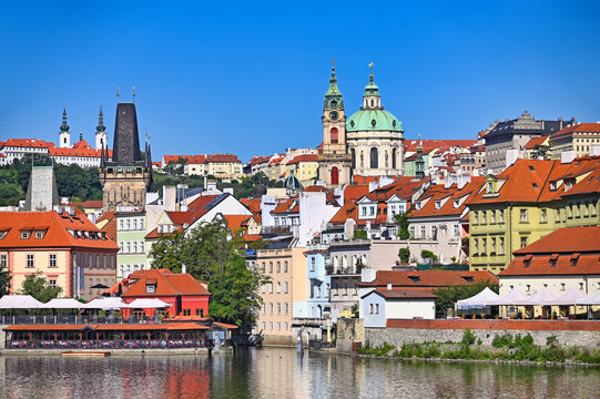 Scenic View of Prague Lesser Town Bridge Tower and Saint Nicholas Church over Vltava River in Czech Republic