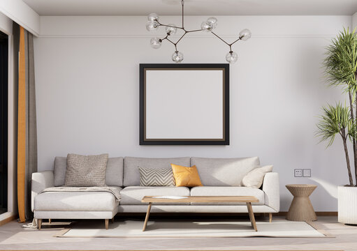 Modern Scandinavian living room interior with beige sectional sofa, blank picture frame mockup and branch chandelier