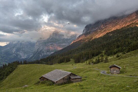 Evening mood, mountain huts, alpine pasture, Pfingstegg, behind the summit of the Wetterhorn, Jungfrau region, Grindelwald, Bern, Switzerland