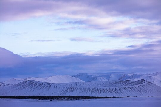Snow-covered extinct volcano Hverfjall at blue hour, near Lake Myvatn, Northern Ireland Eyestra, Iceland