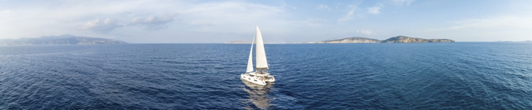 Sailing catamaran in full sail, sailing on the sea, South Aegean, Greece
