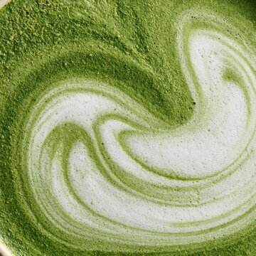Close up macro of matcha latte with swirling foam art