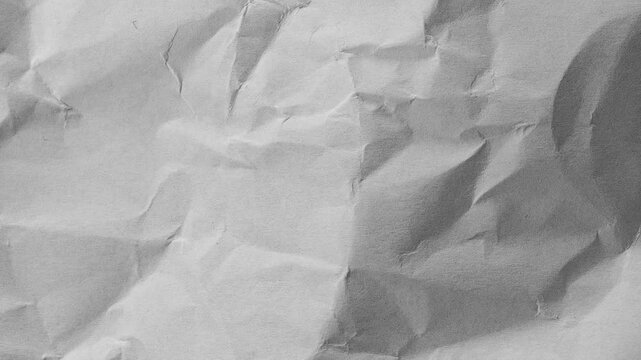Abstract crumpled paper texture background in light grey color