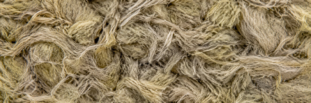 Mineral wool texture with fibers in a natural, earthy color  