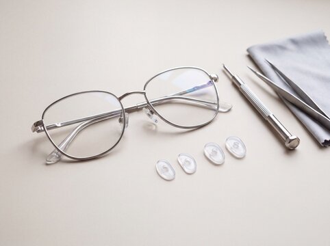 Eyeglasses nose pad replacement kit with silicone pads and precision repair tools