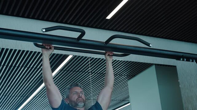 Muscular man sportsman with strong muscle. Sport pullup workout. Sport training. Man sportsman do pullup exercise. Muscular biceps and triceps. Strong athlete. Man pullup in gym
