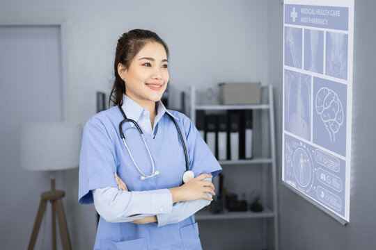 female medical a stethoscope and looking X-ray Scan.