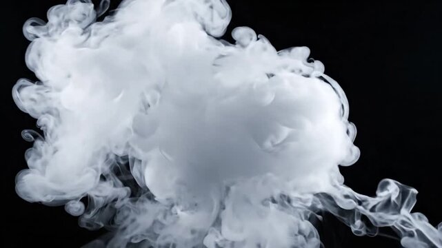 White smoke plume dissolving and swirling against a dark background