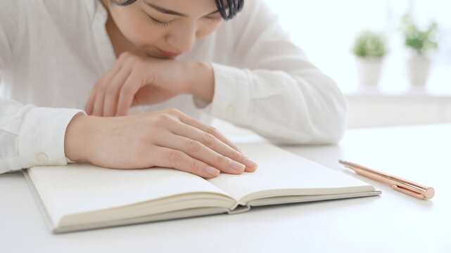Open notebook and pen on a minimal desk