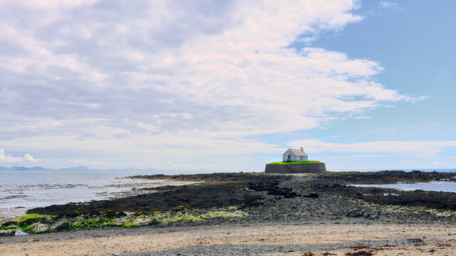 St Cwyfan's Church, also known as Eglwys Cwyfan or the "Little Church in the Sea," sits on the small tidal island of Cribinau off the west coast of Anglesey, Wales