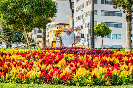 Colorful summer gardens and heart sculpture in Miraflores, Peru