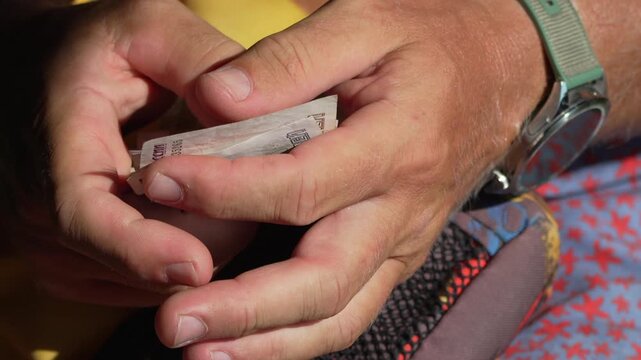 Hands counting money, Russian ruble banknotes close-up for financial transactions