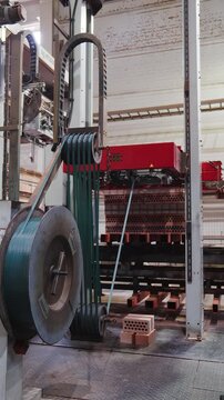 Belt drive of a transfer machine moving kiln cars loaded with bricks at a brick factory