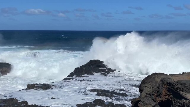 Untamed waves at Le Baracholes beach, Reunion