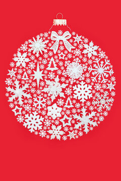 Christmas round shape white bauble tree decorations on red background. Fun surreal design concept for festive Xmas season greeting card.